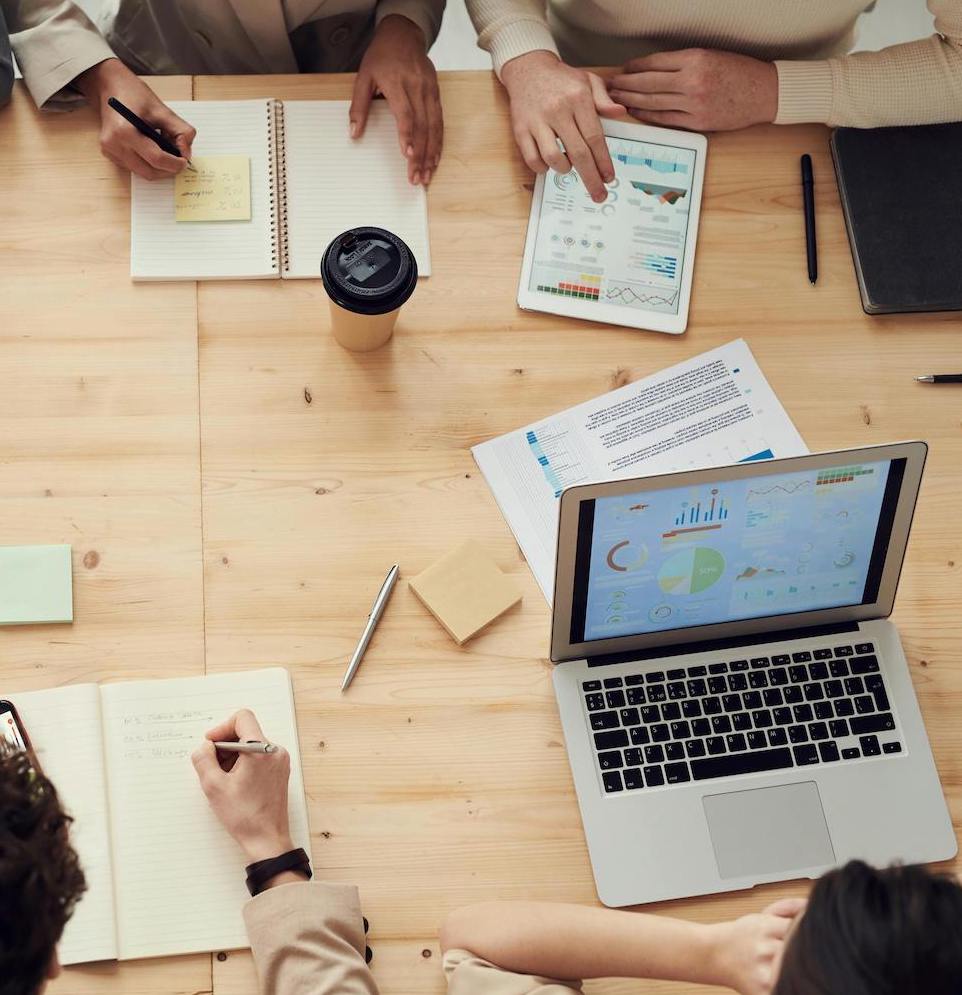 Team of experts in boardroom representing comprehensive family office business services and professional collaboration.