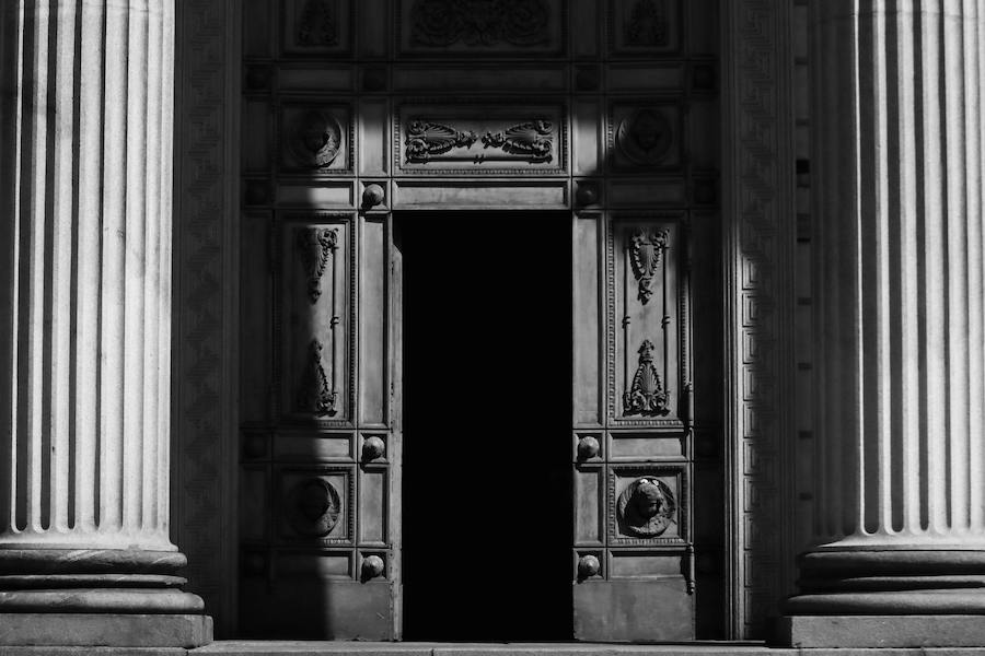 A large ornate door representing new opportunities in private households.